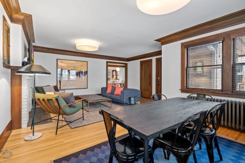 Cozy living and dining space featuring hardwood floors and contemporary furniture.