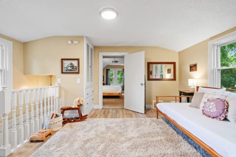 Cozy room featuring a daybed, plush rug, and decorative elements.